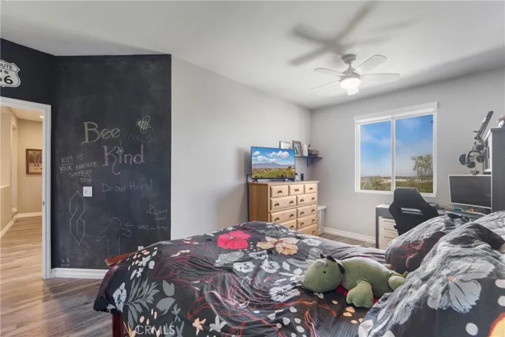 This secondary bedroom boasts amazing views and a chalk board wall!