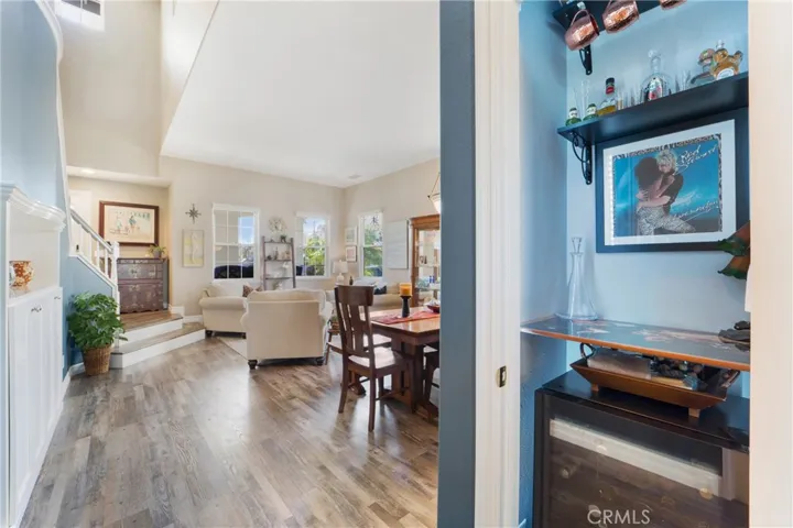 A mini bar sits between the dining room and kitchen.