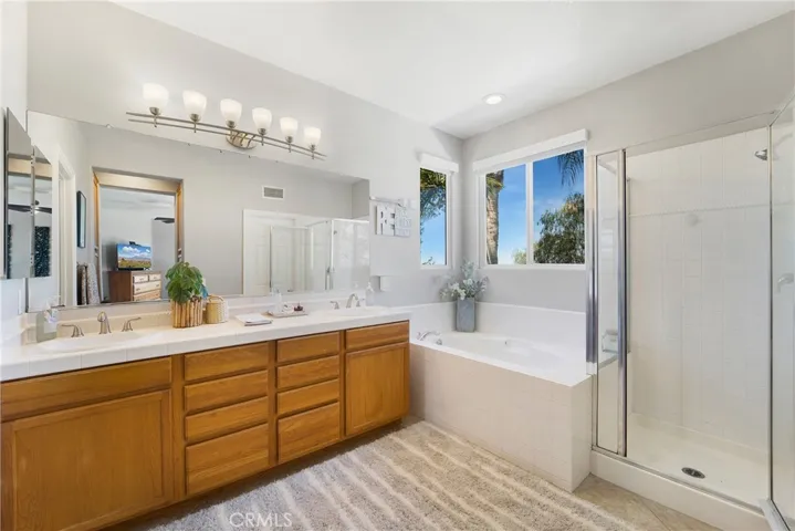 The owner's suite boasts dual vanities, step in shower, tub and views!