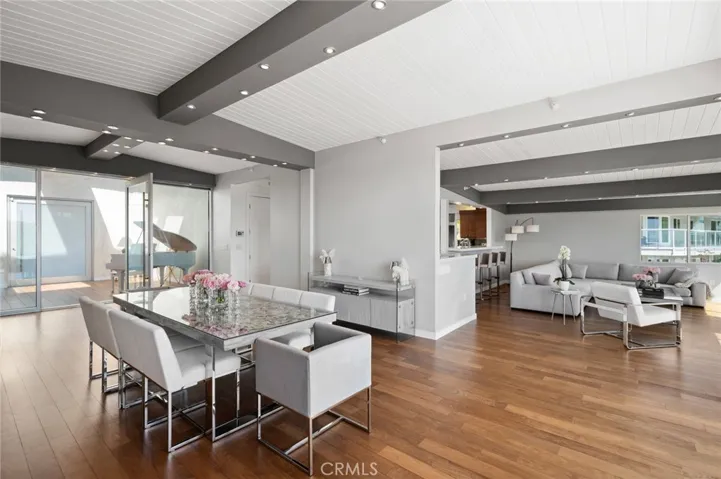 Brazilian walnut hardwood floors and high beamed ceilings