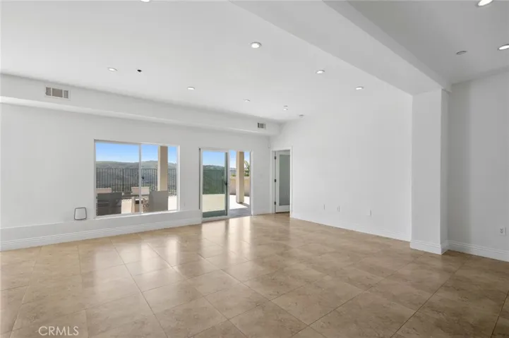 Versatile space that could serve as an office, gym, or additional living room