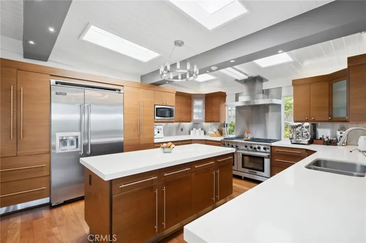 Commercial grade gas stove, a Viking refrigerator and Caesarstone Quartz countertops