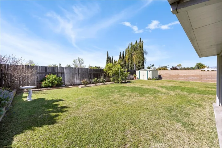 Lots of green grass, patio area and enough room to add a pool