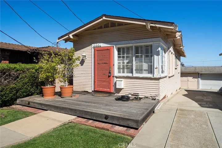 The front of the home and drive way down to garage