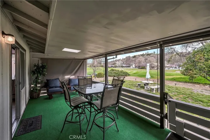 Covered porch with roll down screens - can use in all weather!