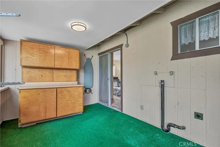 Covered back patio with laundry room