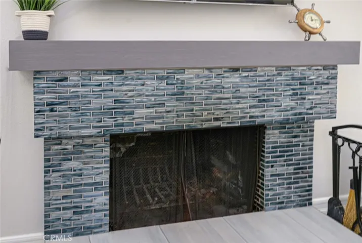 New tile was installed on the front of the fireplace.