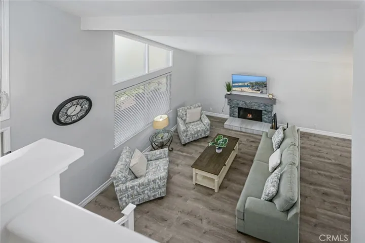 View of the living room from above.  The flooring is a luxury vinyl plank.
