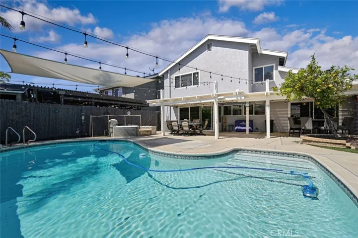 Gorgeous Pool with a fruit producing lemon tree.  There is a removable fence that can be easily installed for child safety.