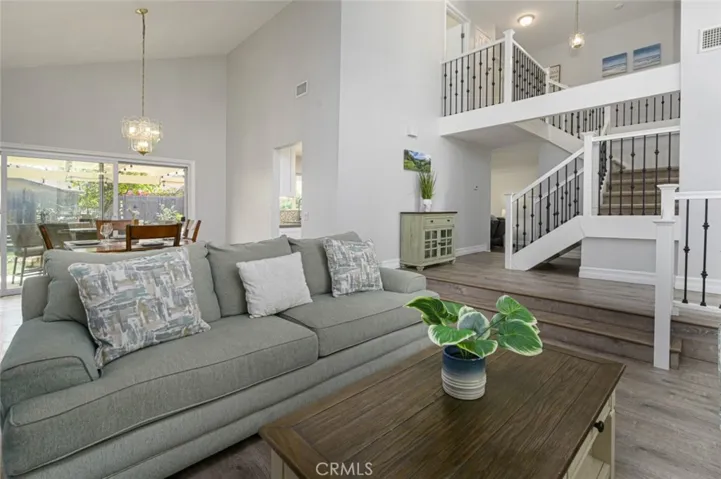View of the living room and dining room.  The stairway was remodeled.