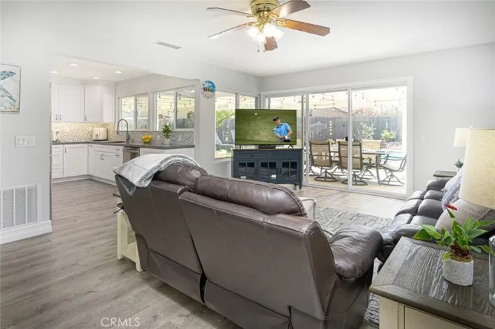 The kitchen and family room.   The dual pane windows and sliding glass door opens up to the backyard.
