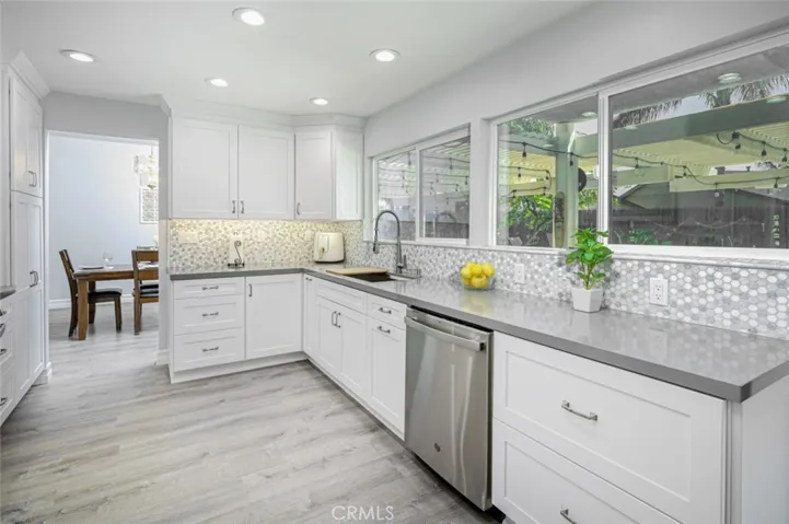 There are pull out drawers and soft close cabinets in this remodeled kitchen.