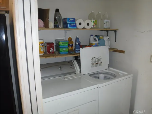 Laundry room with door to garage and storage on the other side of the room