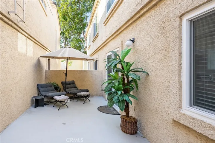 Private patio with direct garage access.