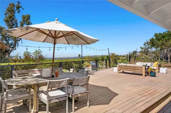 An oversized homesite of nearly 6,880 square feet reveals a welcoming entry with mature and manicured landscaping, and an extra-generous ocean-view deck in the back.