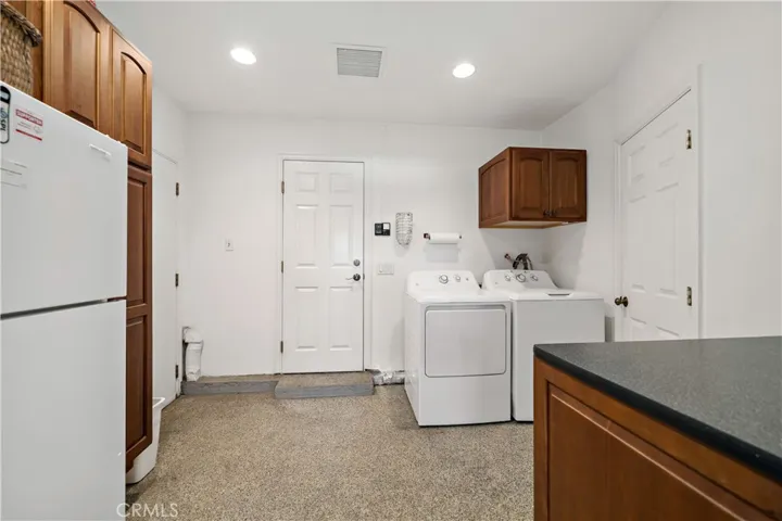 3rd space of garage converted for laundry, storage, etc...could be converted back to 3rd space for vehicle.