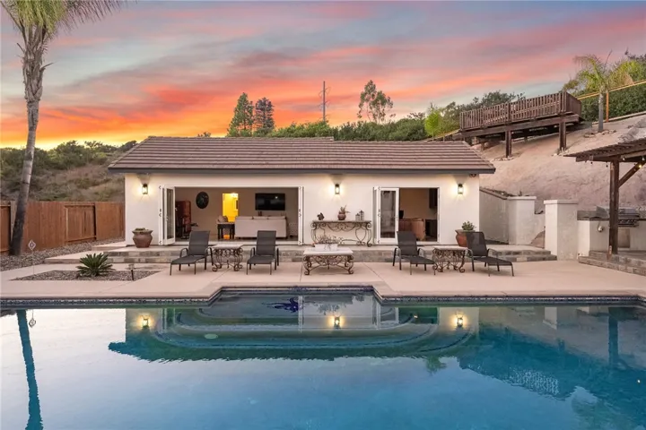 Pool with view of the 2 bedroom ADU with accordian doors.