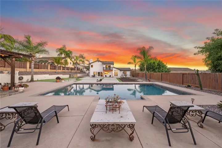 Pool with view of the back of the main house