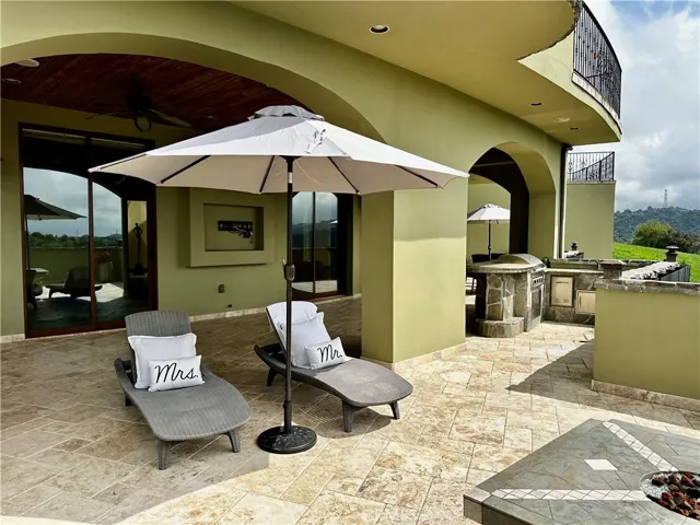 Fire pit area with ocean and canyon views