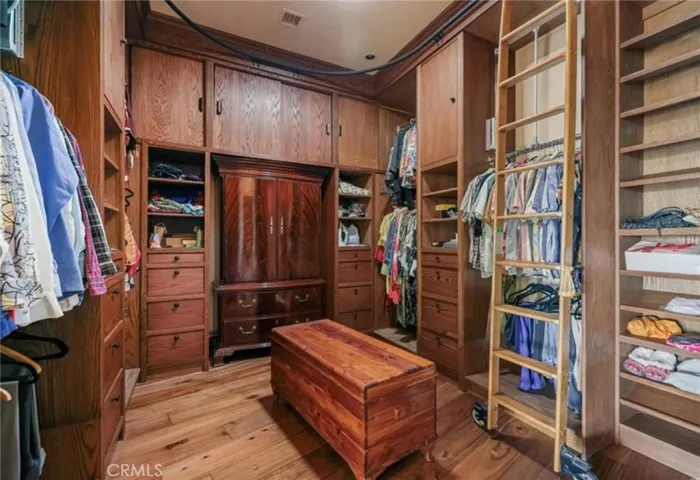 Primary closet with laundry closet. Main laundry downstairs next to maids suite
