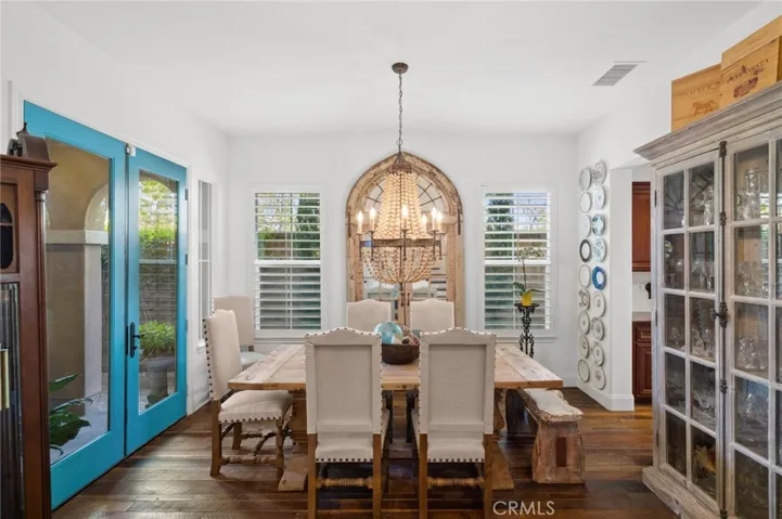 The formal dining space with French doors out to the covered front porch area