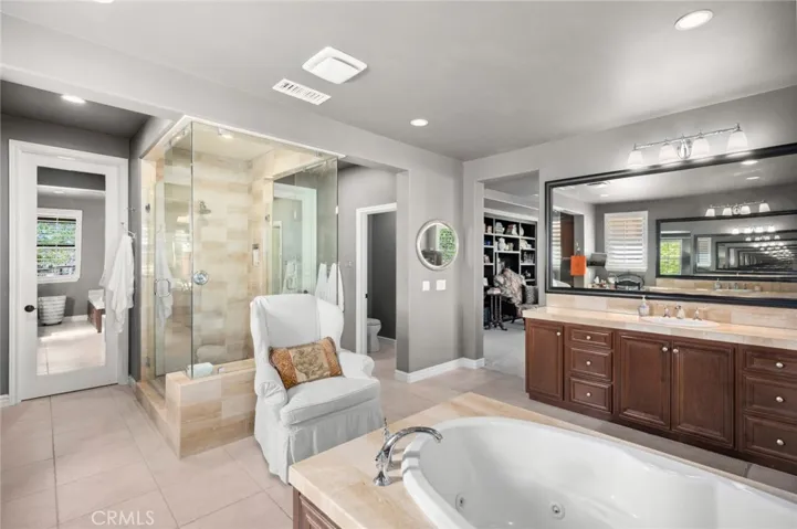 Primary bath with roomy dual walk in closets