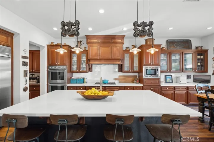 So many custom details... the butlers pantry, stainless appliances, designer lighting and so much more!