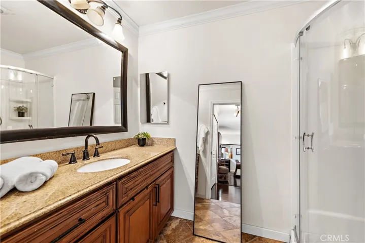 Remodeled bathroom with newer fixtures, granite counters and newer cabinets.