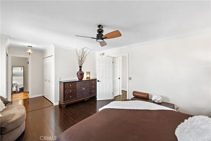 The larger primary bedroom with dual closets and it's own bathroom.