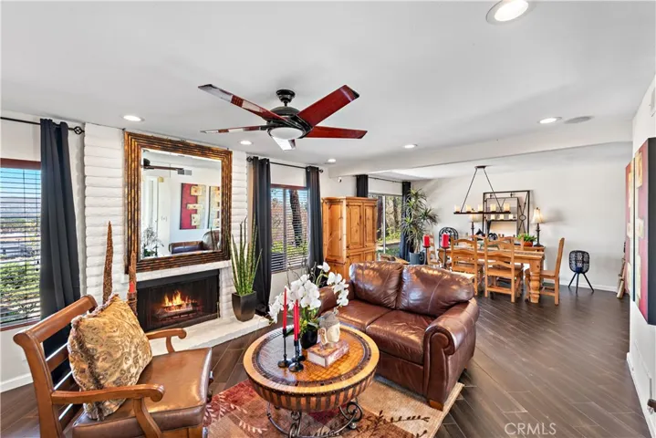 The living room boasts a wood burning fireplace, recessed lighting and a surround system for your listening pleasure.