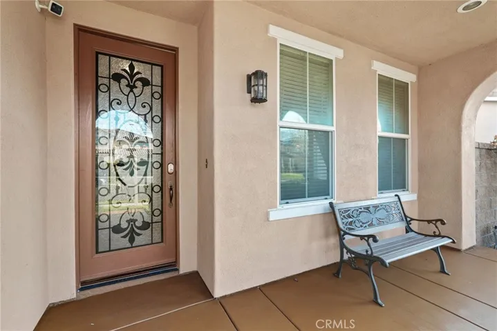 Glass/iron door entry with covered porch