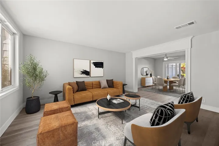 FORMAL LIVING ROOM LOOKING TOWARD DINING ROOM.