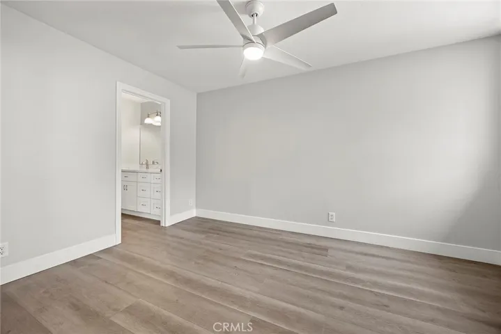 ONE GUEST BEDROOM WITH CEILING FAN.