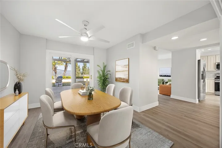 FORMAL DINING ROOM LOOKING TOWARDS BACKYARD.