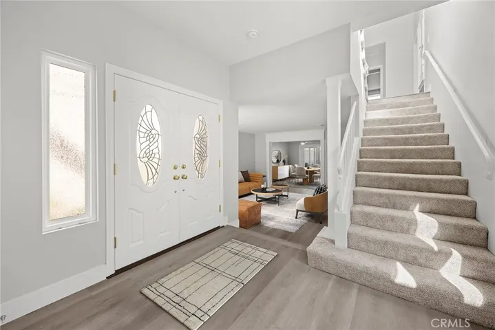 ENTRY LOOKING TOWARD LIVING ROOM AND DINING ROOM