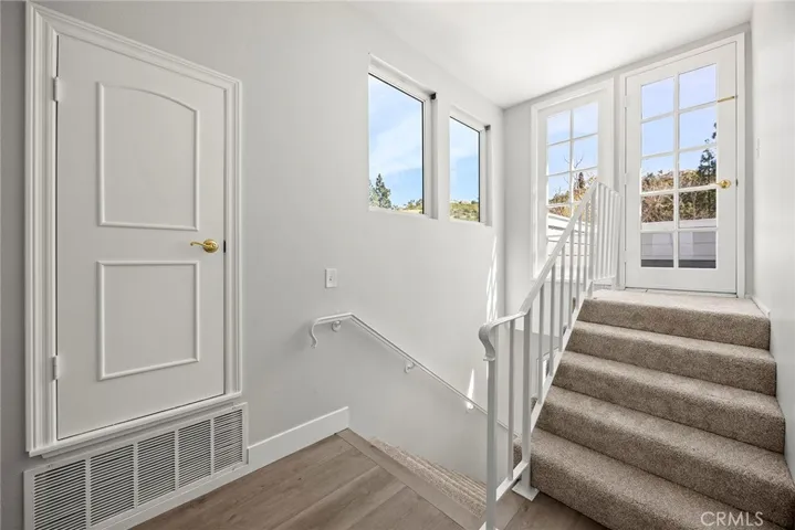 STAIRS TO UPSTAIRS BALCONY.