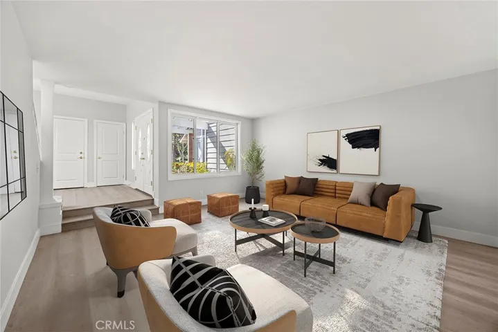 FORMAL LIVING ROOM LOOKING TOWARD FRONT DOOR.
