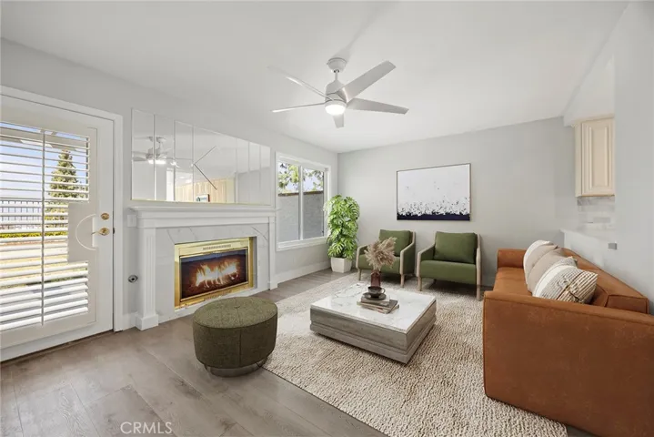 FAMILY ROOM WITH COZY FIREPLACE AND FRENCH DOOR TO BACKYARD.