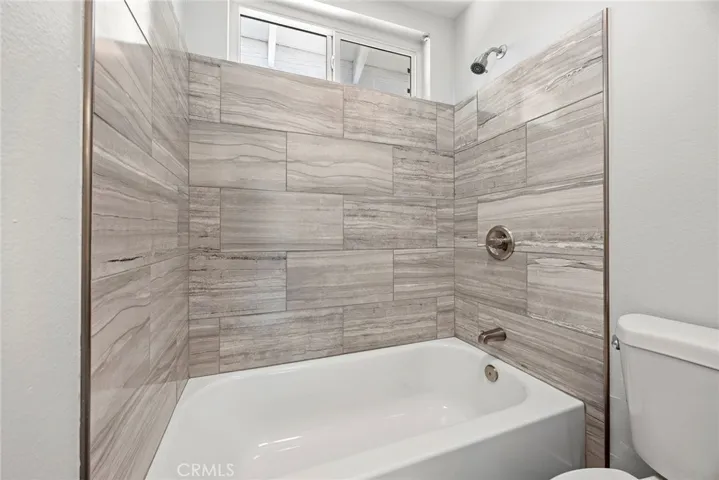 GUEST BATH WITH SHOWER OVER TUB.