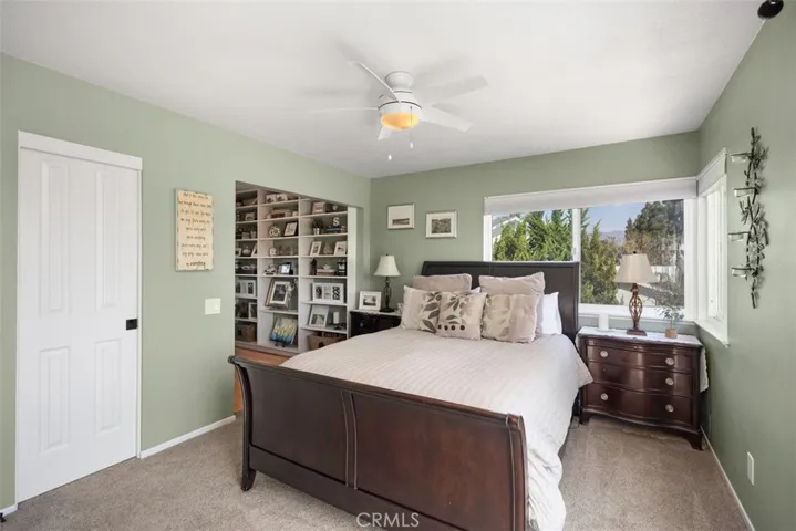 Primary bedroom with large walk in closet & spacious retreat area.