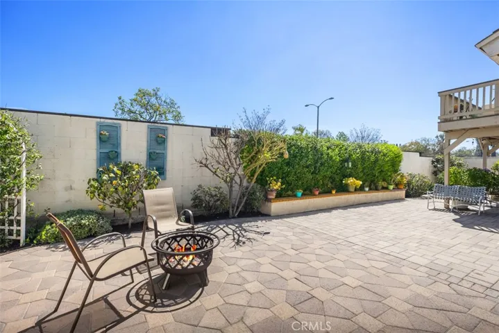 Private backyard with custom pavers.