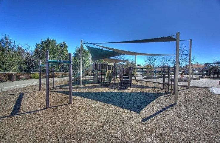A spacious community park with tennis and volleyball courts, perfect for an active lifestyle.