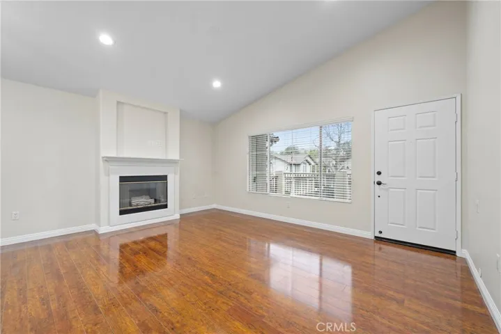 The spacious family and dining room welcome you with high ceilings and a cozy fireplace.

