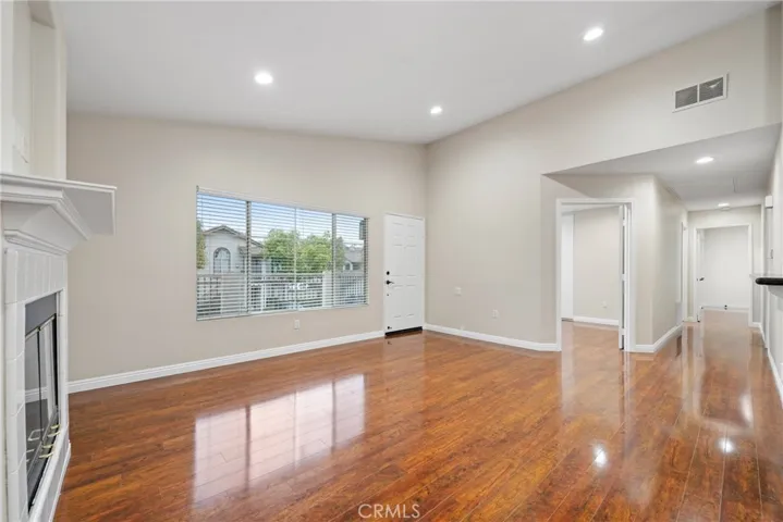 Recessed lighting, scraped ceilings, and laminate floors add a modern touch throughout.


