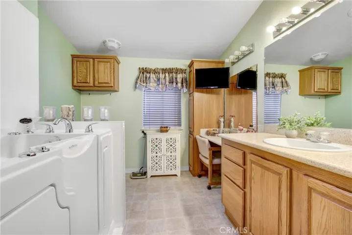 Master Bath with Jacuzzi Tub and Vanity Area