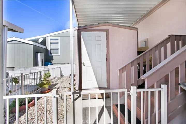 Back Steps from Laundry Room leads out to Driveway and Large Shed