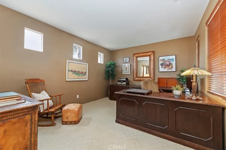 Pre-plumbed main floor large office can be converted to 5th bedroom or casita with single car Garage.