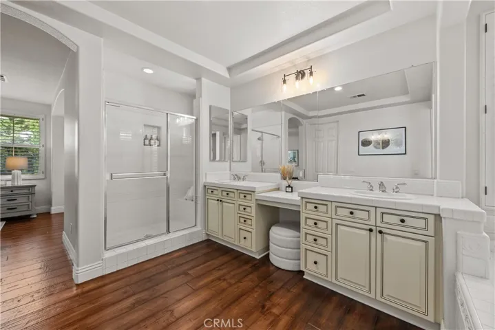 Spacious Primary Bath with Sitting Area, Dual Vanities, Large Shower with Bench Seating