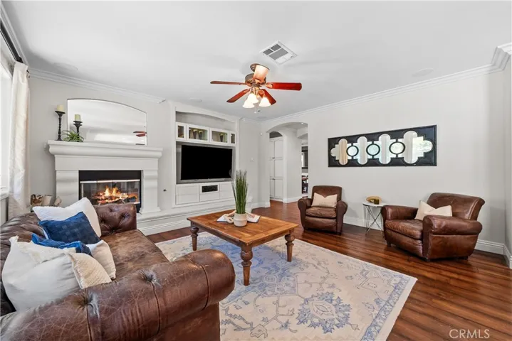 Inviting Family Room boast Gas Fireplace, warm Wood Floors and Builtin Media Center Complete with Surround Sound