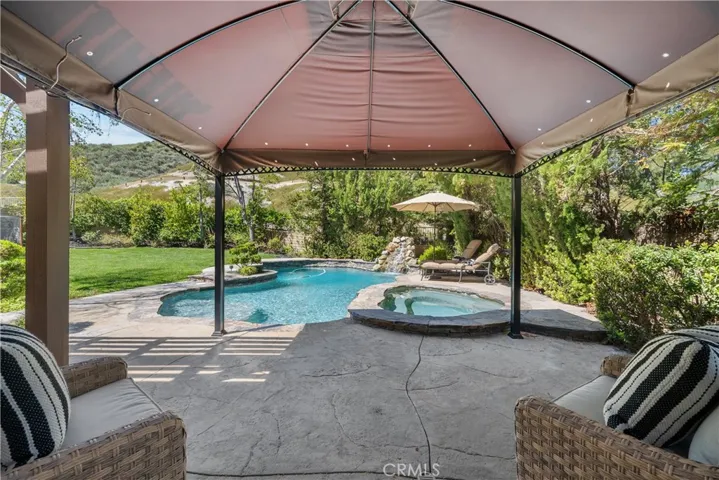 Keep Cool Under the Shade and Misting System in the Cabana